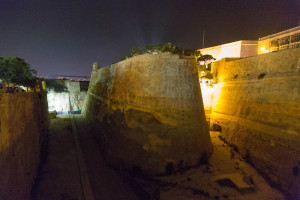 The wall of Valetta at night.